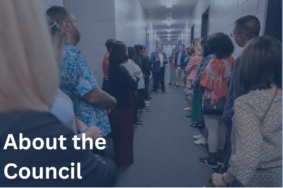 Group standing in hallway of an Opportunity Center featuring the text 