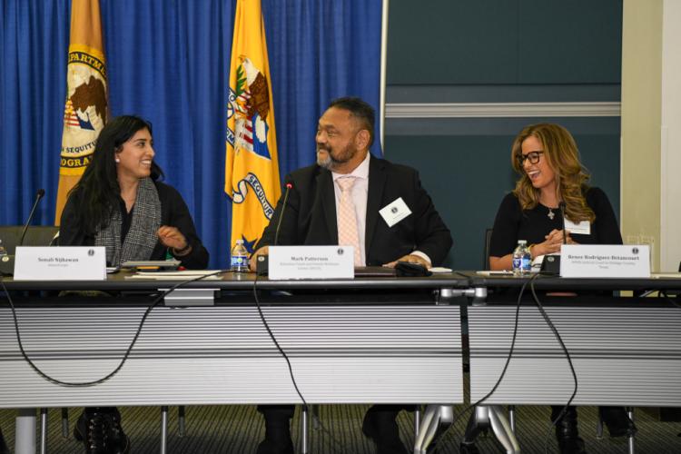 Sonali Nijhawan, Mark Patterson and Judge Renee Rodriguez-Betancourt speak with one another at the Council's December meeting.