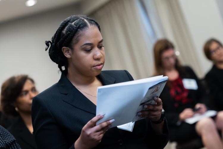 Meeting Attendee reading attentively
