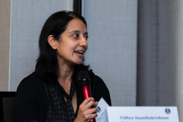 Vidhya Ananthakrishnan, Director of Youth Justice Initiatives, Columbia Justice Lab speaking and holding the microphone