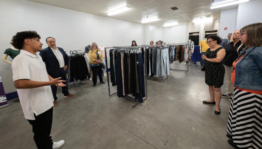 A student showing the Coordinating Council group around the Opportunity Center