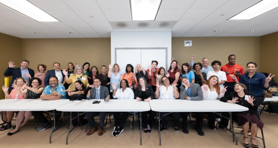 Group photo of the Coordinating Council and presenters waving